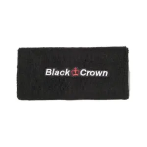 Two young people playing padel tennis on a sunny day.